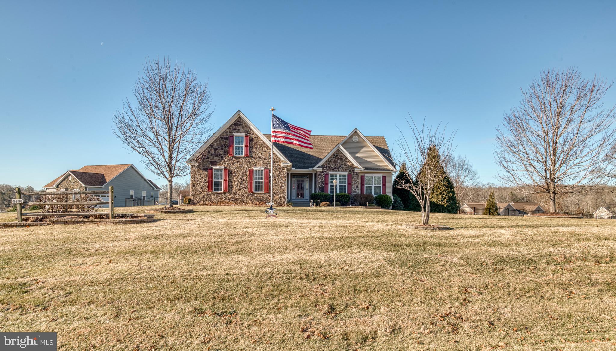 9408 Blackbird Loop Culpeper, VA 22701 - Photo 44 of 89 a front view of a house with a yard and garage