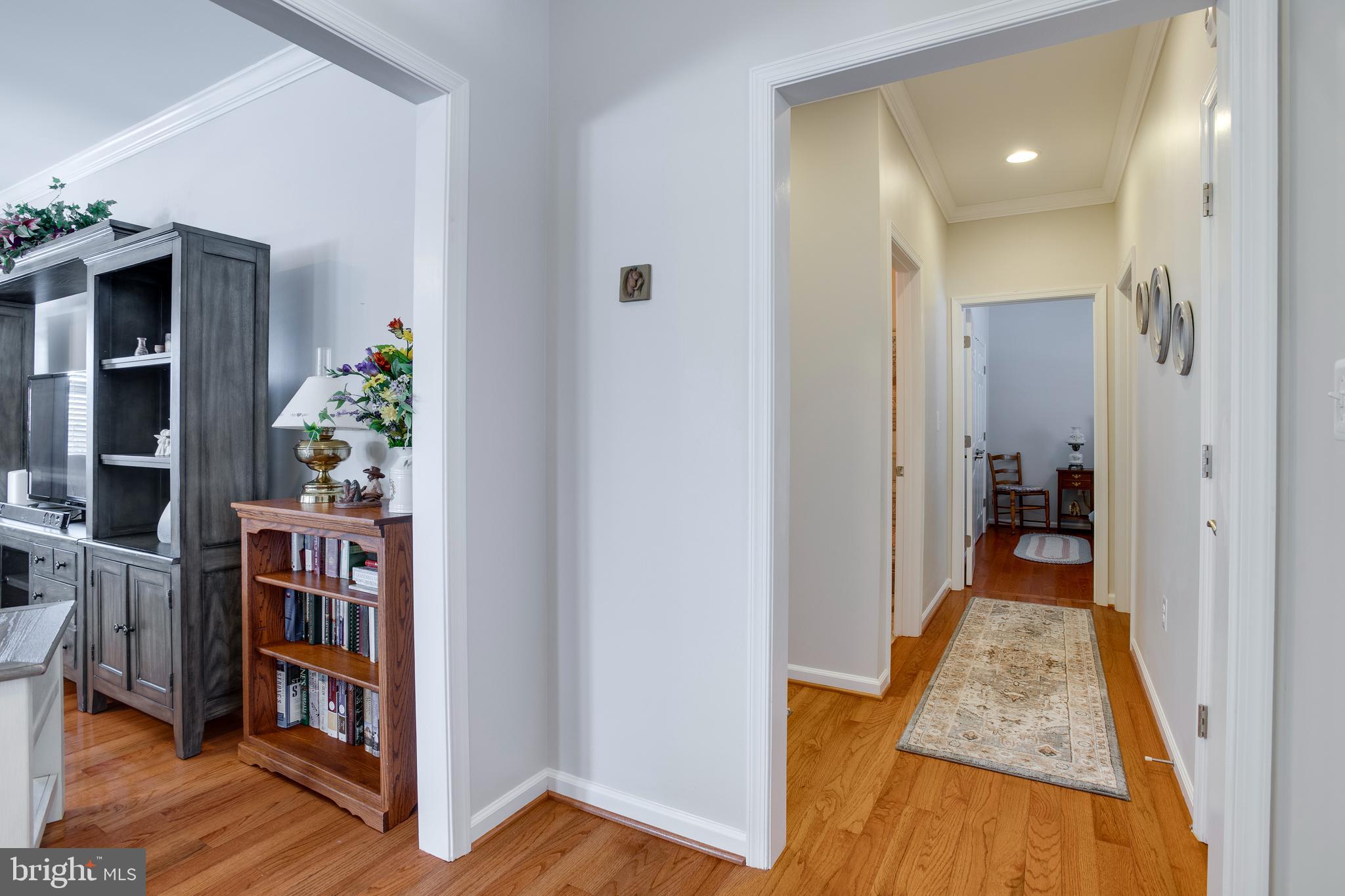 9408 Blackbird Loop Culpeper, VA 22701 - Photo 5 of 89 a view of a hallway view with wooden floor and staircase