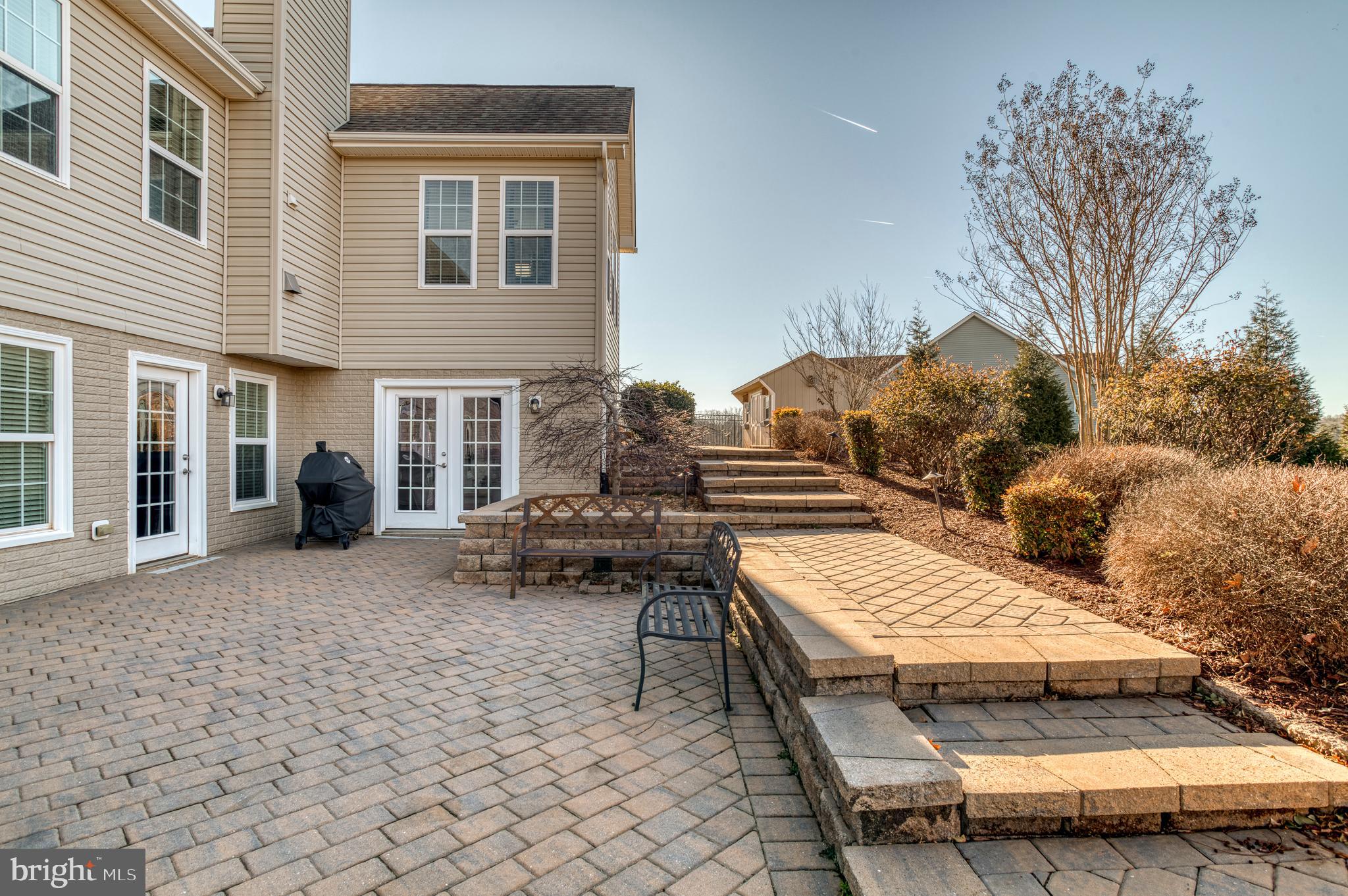 9408 Blackbird Loop Culpeper, VA 22701 - Photo 54 of 89 a view of a patio with couches table and chairs and potted plants