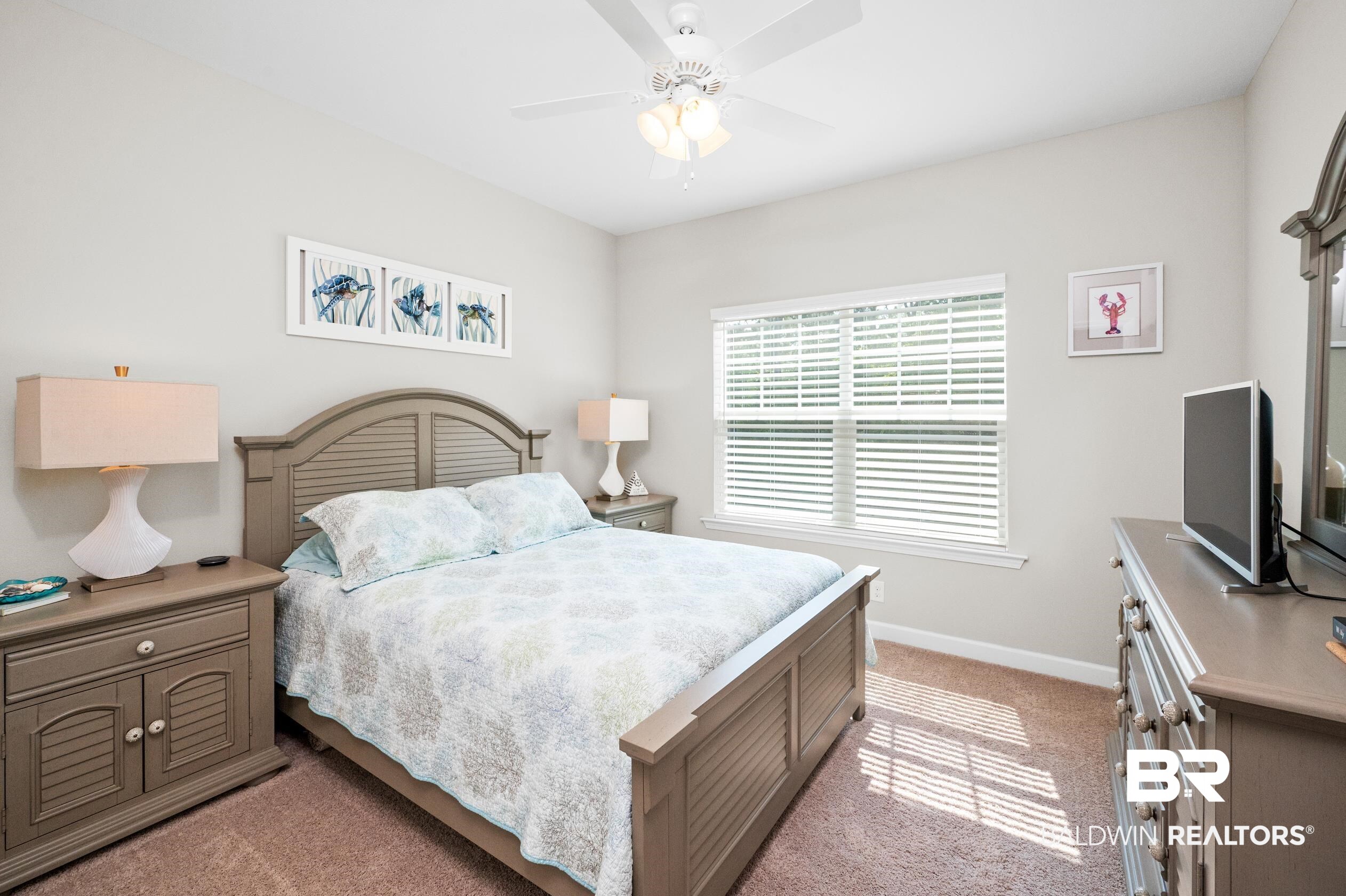 430 West Fort Morgan Road, Unit 1902 Gulf Shores, AL 36542 - Photo 33 of 59 Carpeted bedroom featuring ceiling fan