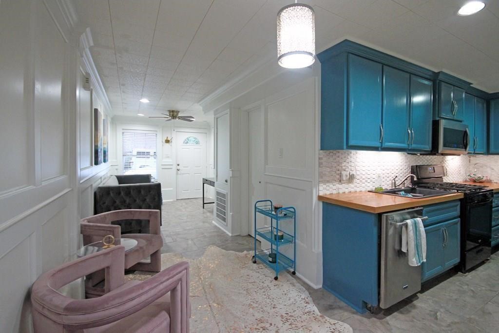 434 Lenard Street, Unit F Houston, TX 77009 - Photo 3 of 15 a kitchen with stainless steel appliances granite countertop a stove and a sink