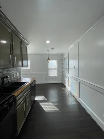 a kitchen with stainless steel appliances a stove and a refrigerator