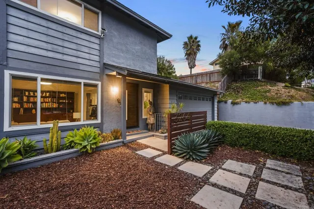 a front view of a house with garden