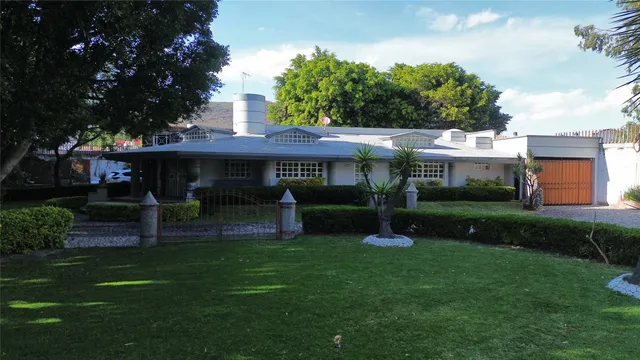 a view of a house with a yard porch and sitting area