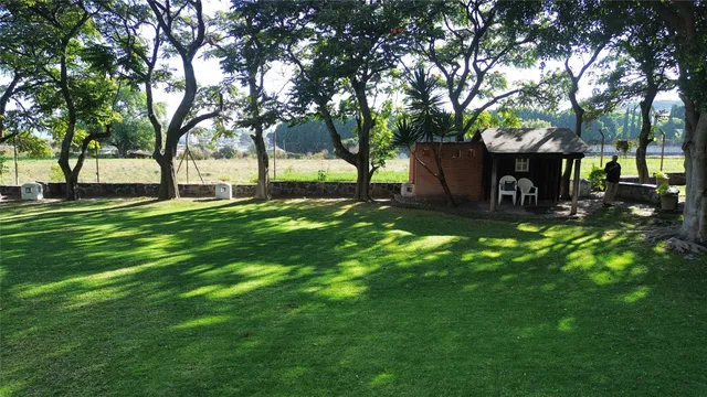 a house view with a sitting space and garden