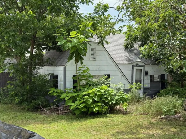 a house with a tree in front of it