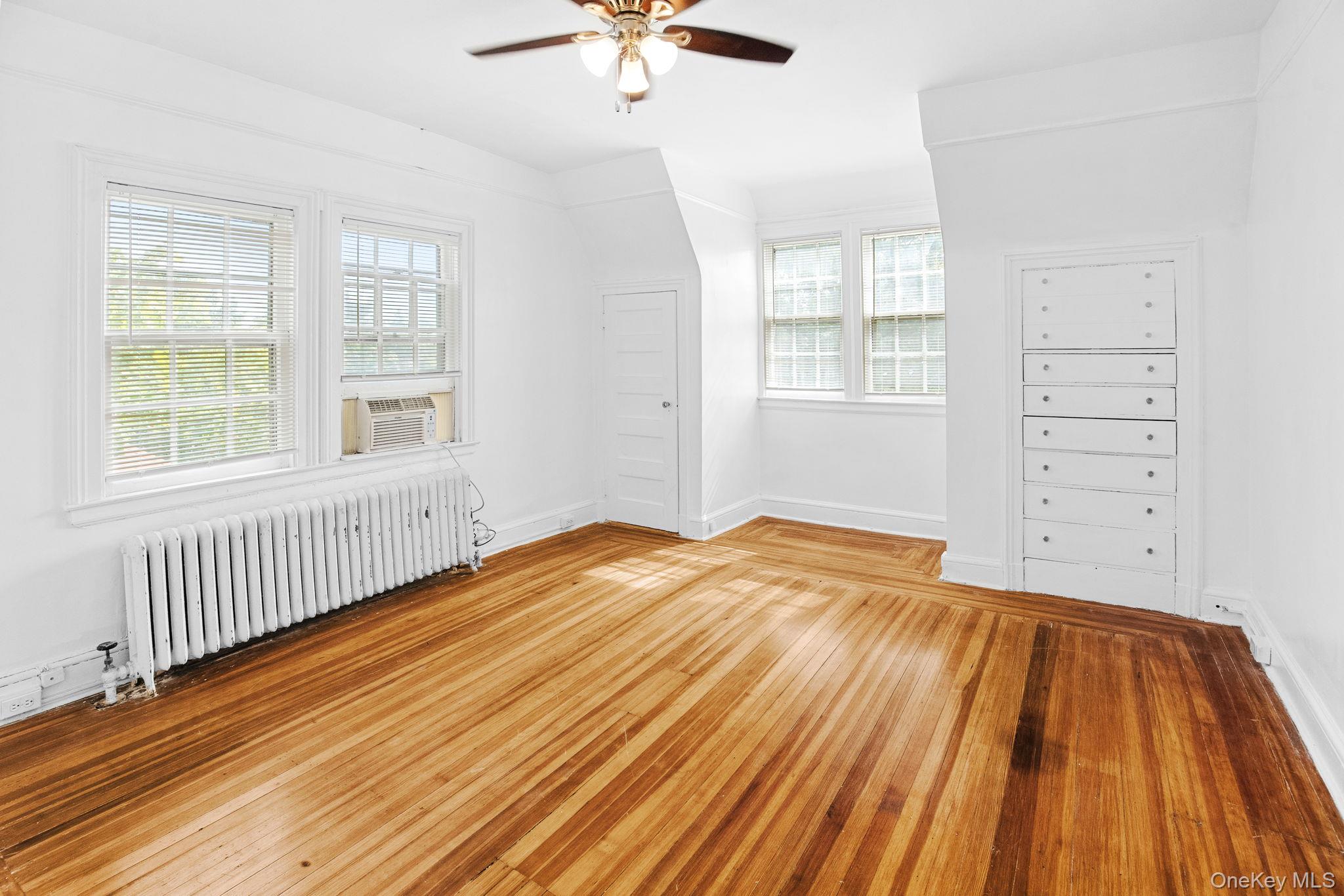 72 Hamilton Avenue New Rochelle, NY 10801 - Photo 14 of 28 an empty room with windows