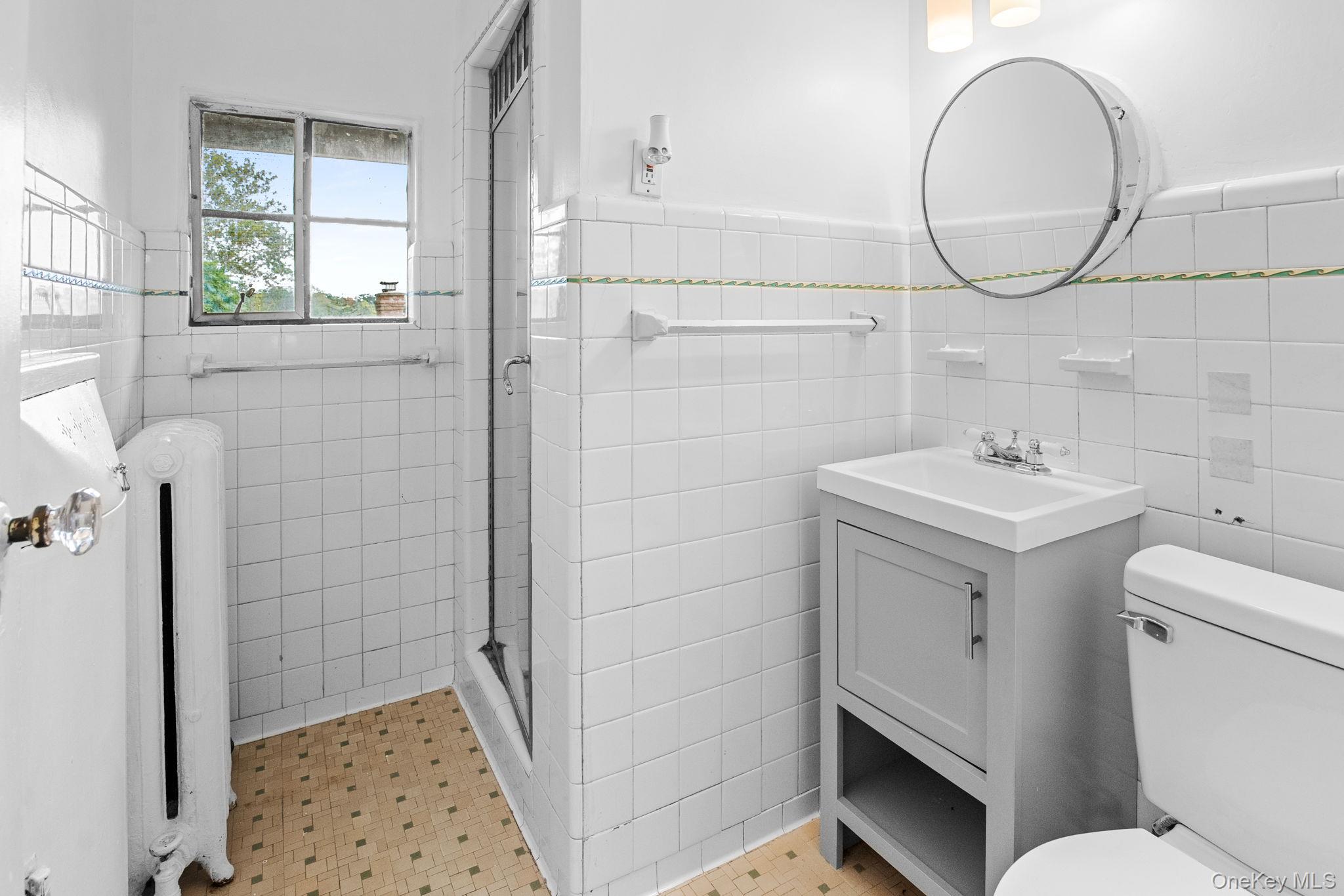 72 Hamilton Avenue New Rochelle, NY 10801 - Photo 15 of 28 a bathroom with a sink toilet and shower