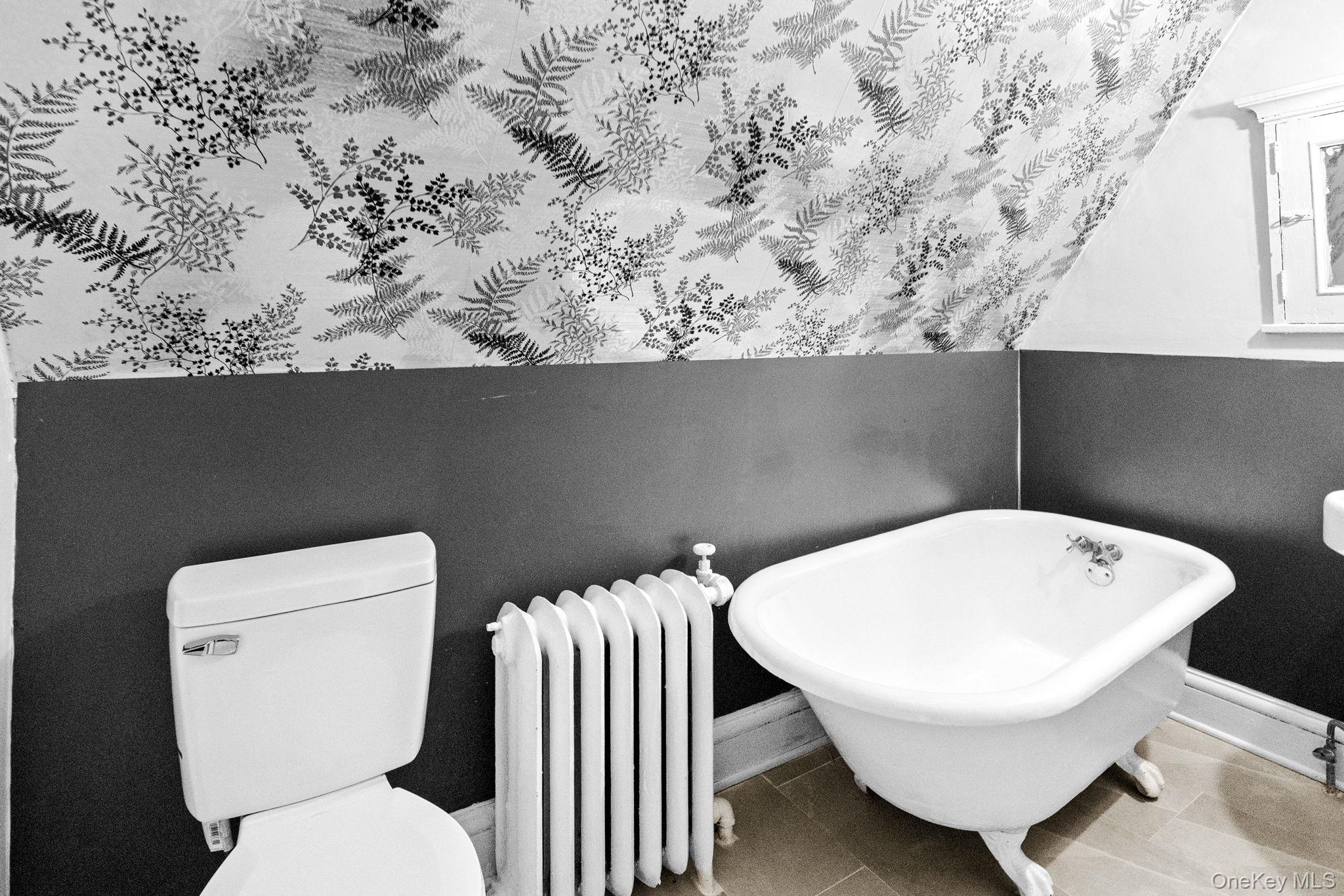 72 Hamilton Avenue New Rochelle, NY 10801 - Photo 18 of 28 a white toilet sitting next to a white wall