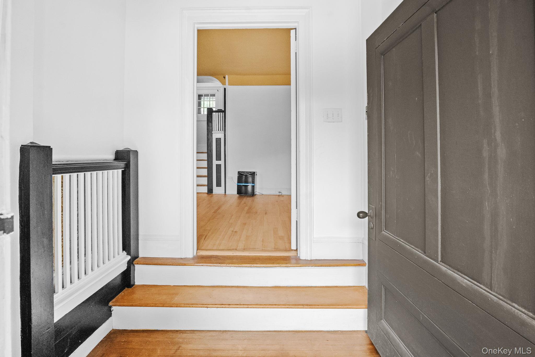 72 Hamilton Avenue New Rochelle, NY 10801 - Photo 2 of 28 a view of a hallway with wooden floor and staircase