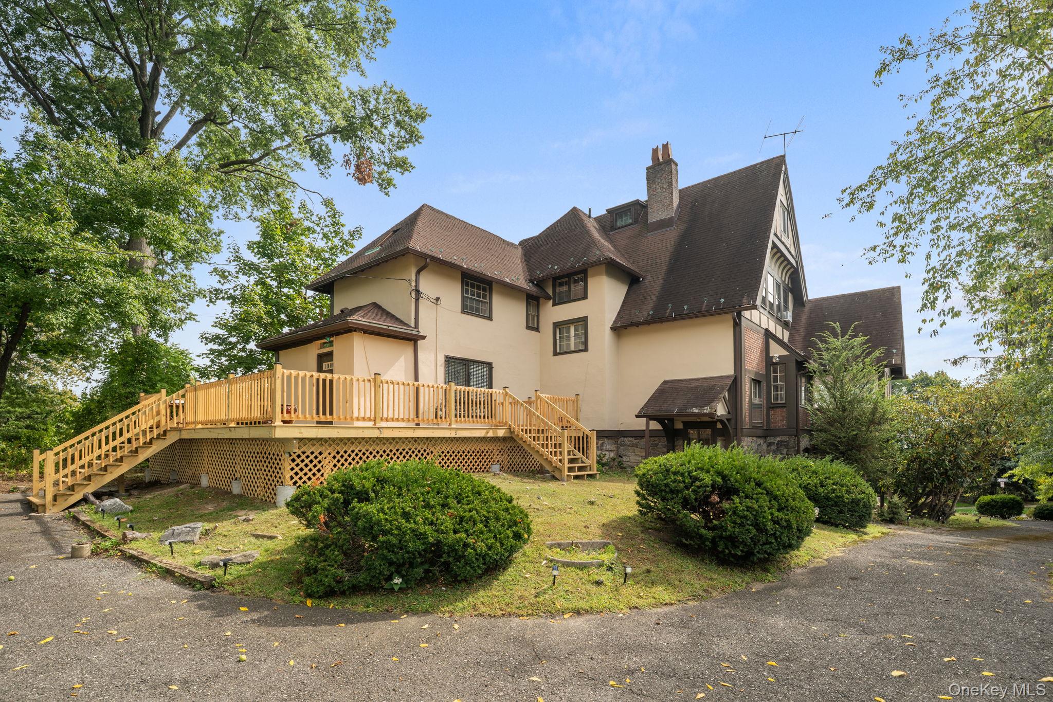72 Hamilton Avenue New Rochelle, NY 10801 - Photo 22 of 28 a front view of a house with a garden