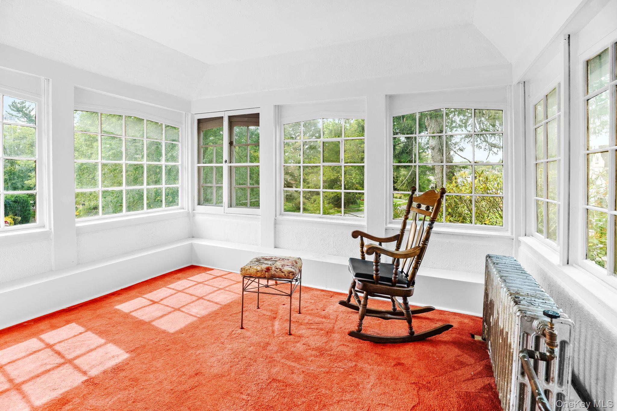 72 Hamilton Avenue New Rochelle, NY 10801 - Photo 7 of 28 a living room filled with furniture and a large window