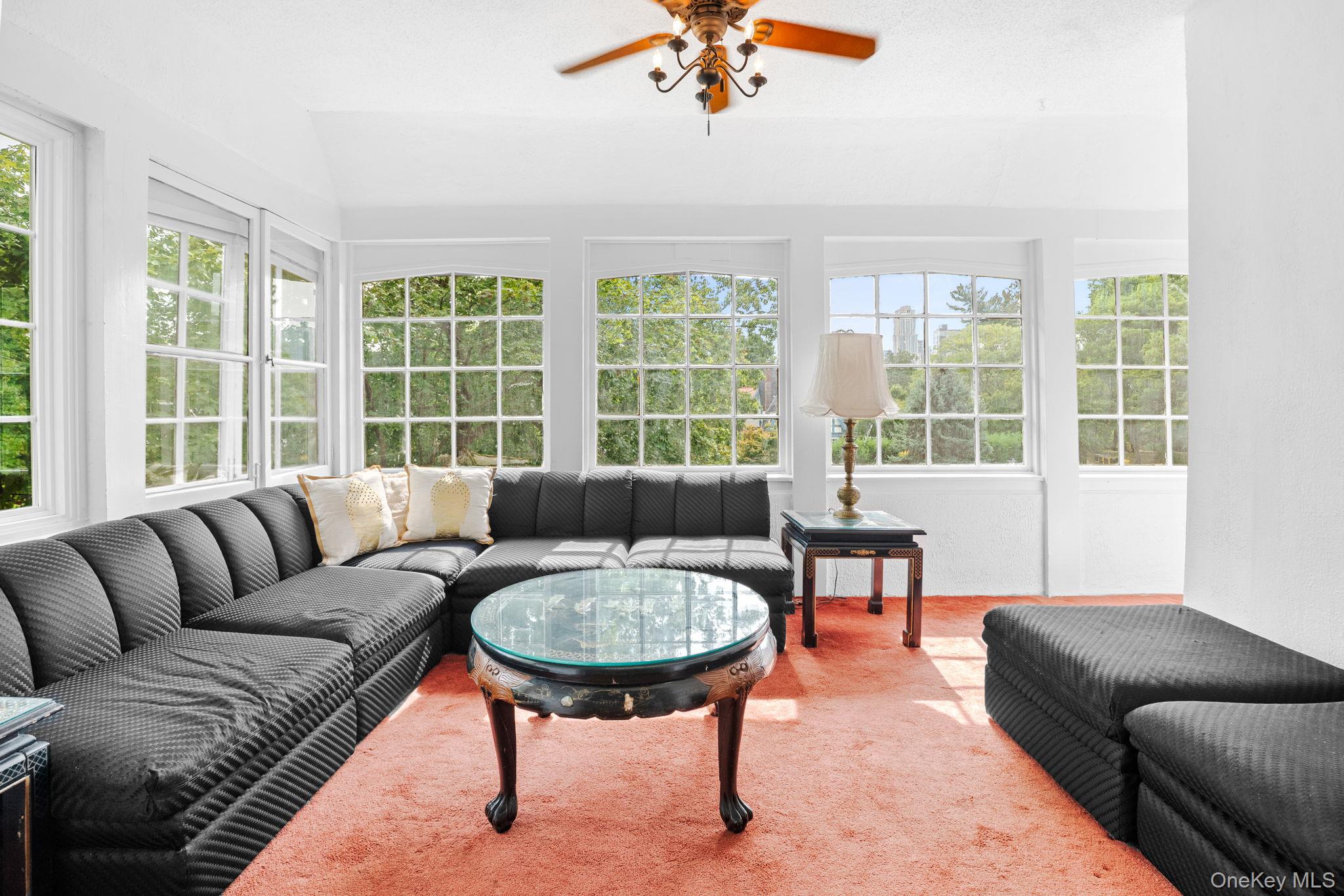 72 Hamilton Avenue New Rochelle, NY 10801 - Photo 8 of 28 a living room with furniture and a large window