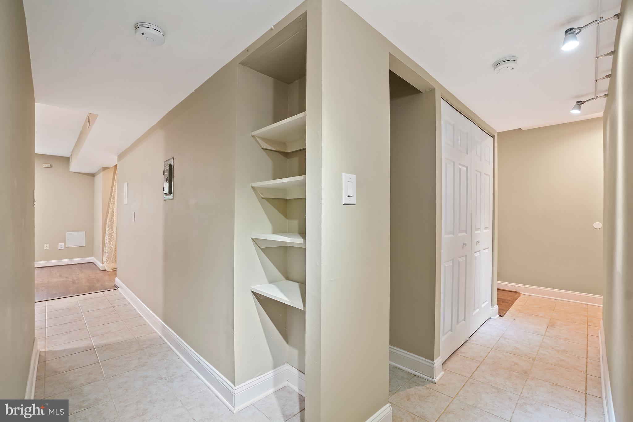 8487 Greenbelt Road Greenbelt, MD 20770 - Photo 13 of 29 a view of a hallway with walk in closet
