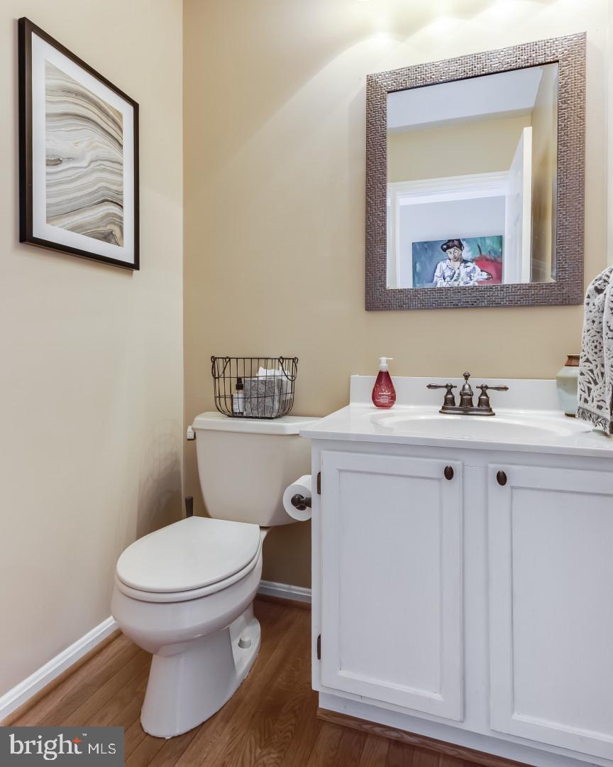 307 Riding Ridge Road Annapolis, MD 21403 - Photo 20 of 36 a bathroom with a toilet sink and mirror
