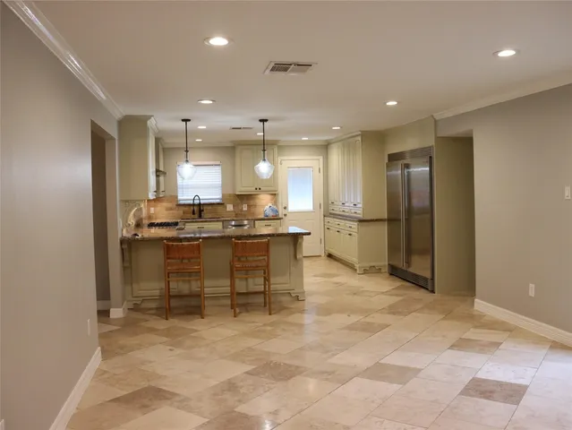 a view of kitchen with counter top space and stainless steel appliances