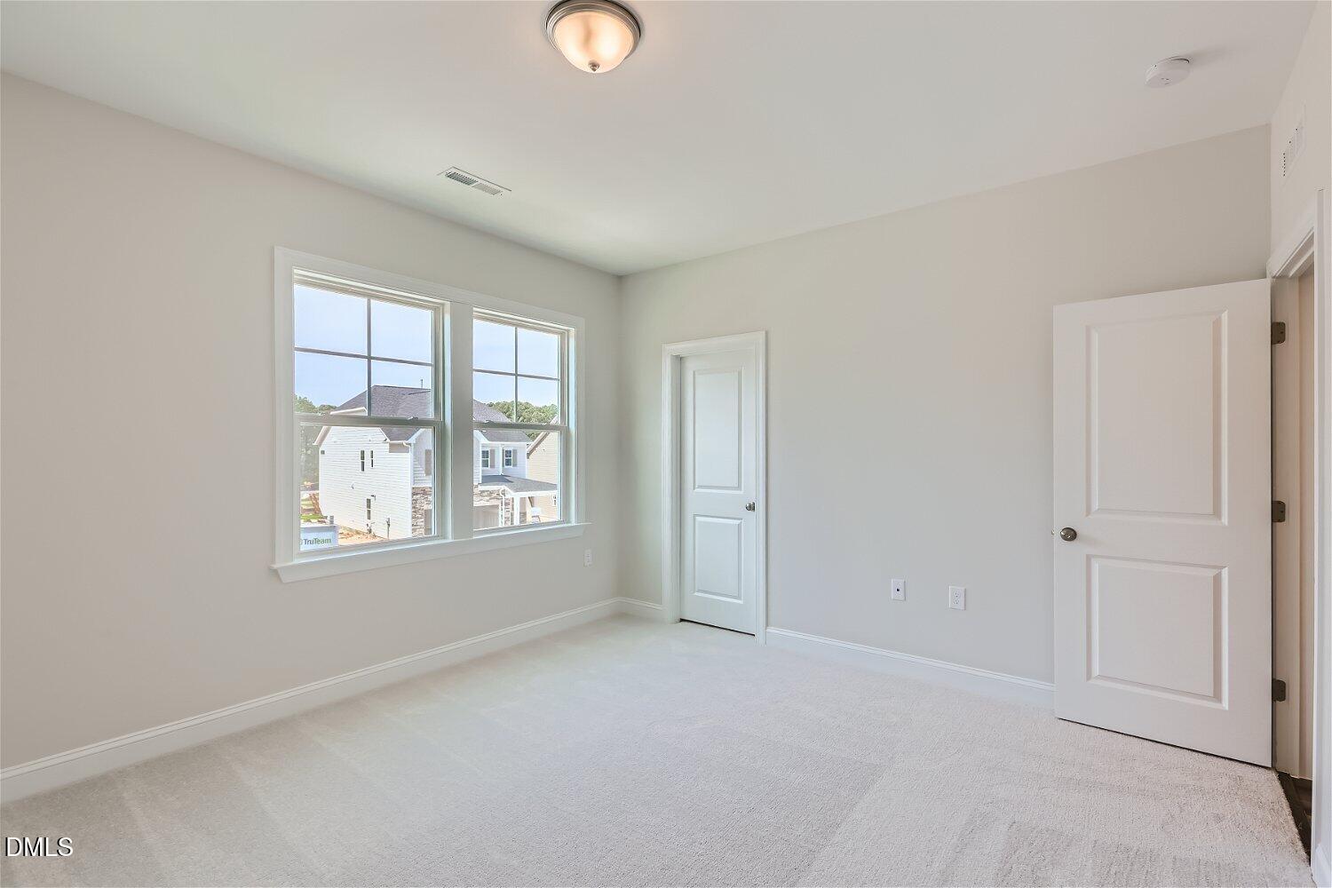 124 Fablewood Trail Garner, NC 27529 - Photo 11 of 27 a view of an empty room with a window