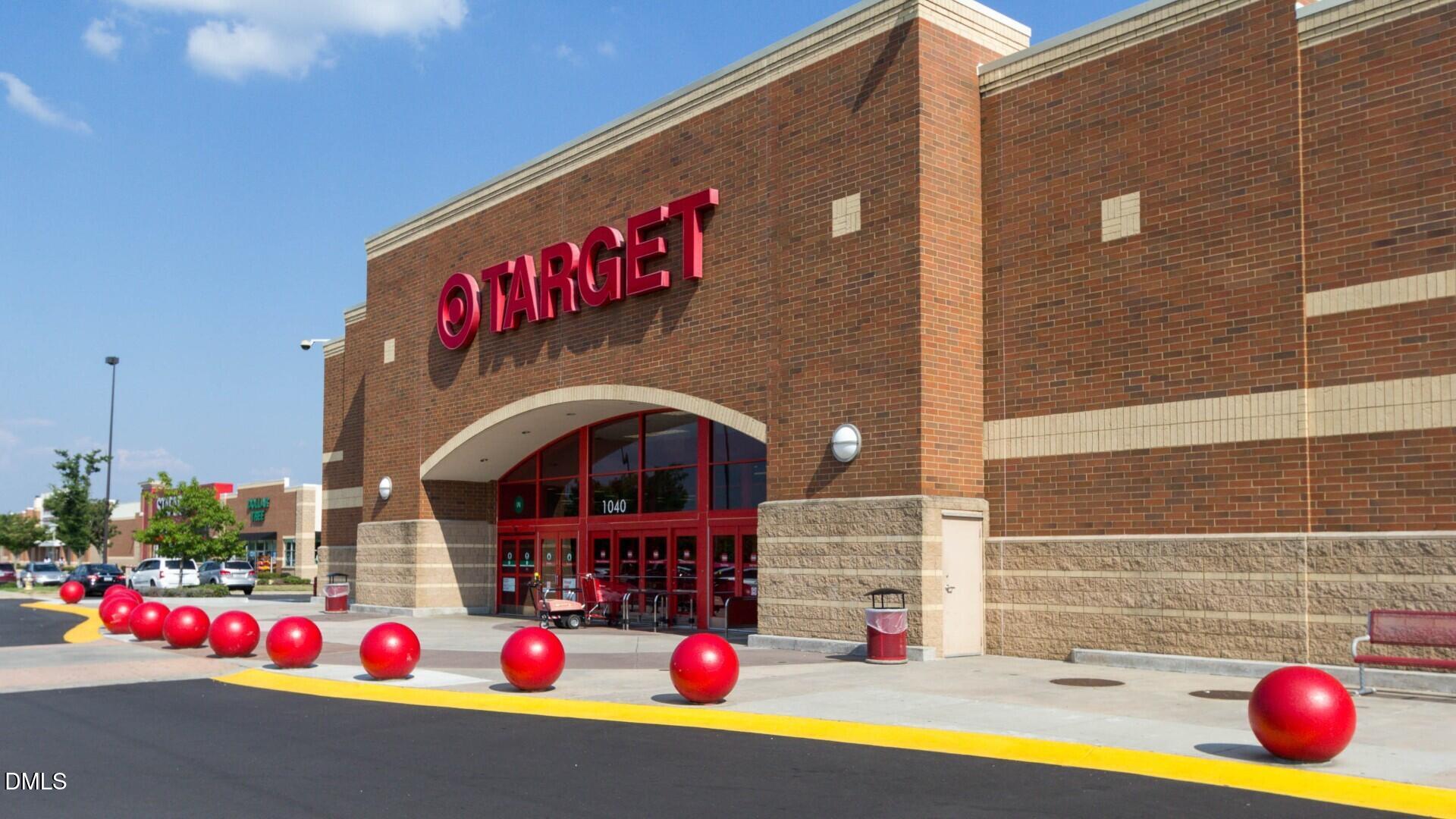 124 Fablewood Trail Garner, NC 27529 - Photo 22 of 27 a play ground with red flowers