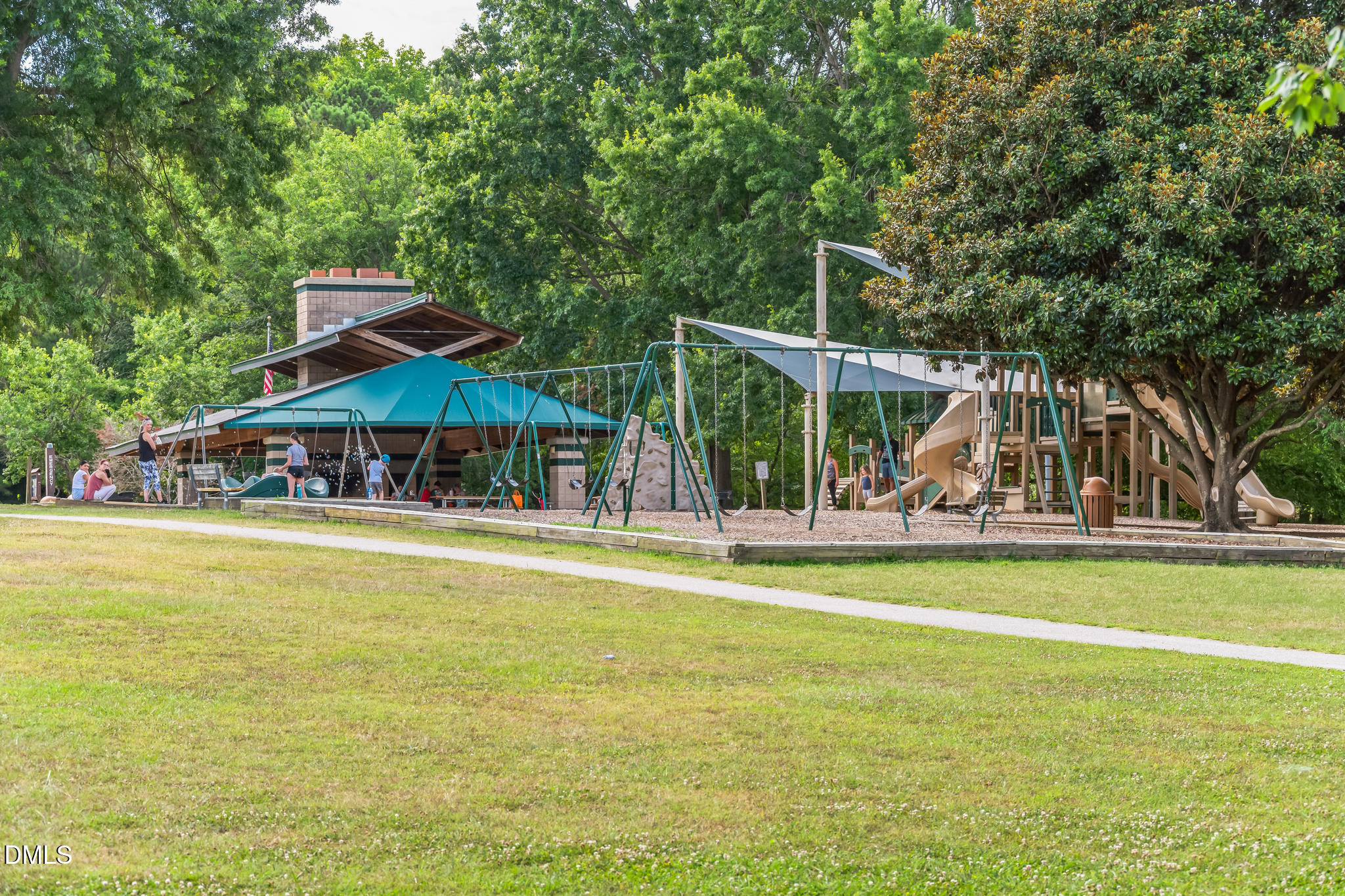 124 Fablewood Trail Garner, NC 27529 - Photo 26 of 27 a view of a swimming pool with lawn chairs under an umbrella