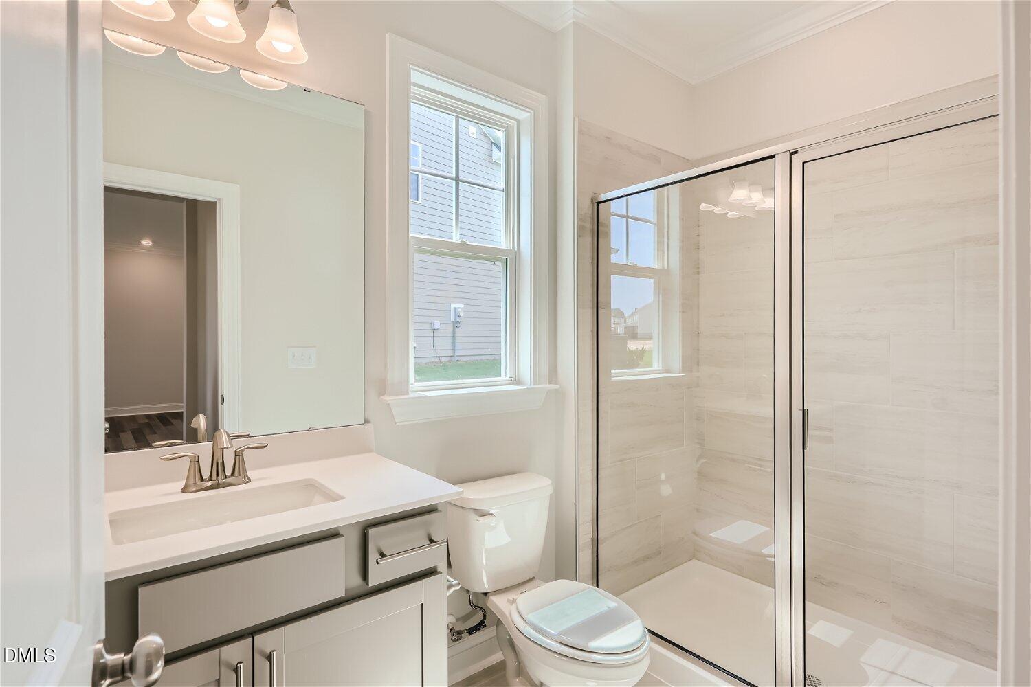 124 Fablewood Trail Garner, NC 27529 - Photo 6 of 27 a bathroom with a sink toilet vanity and shower