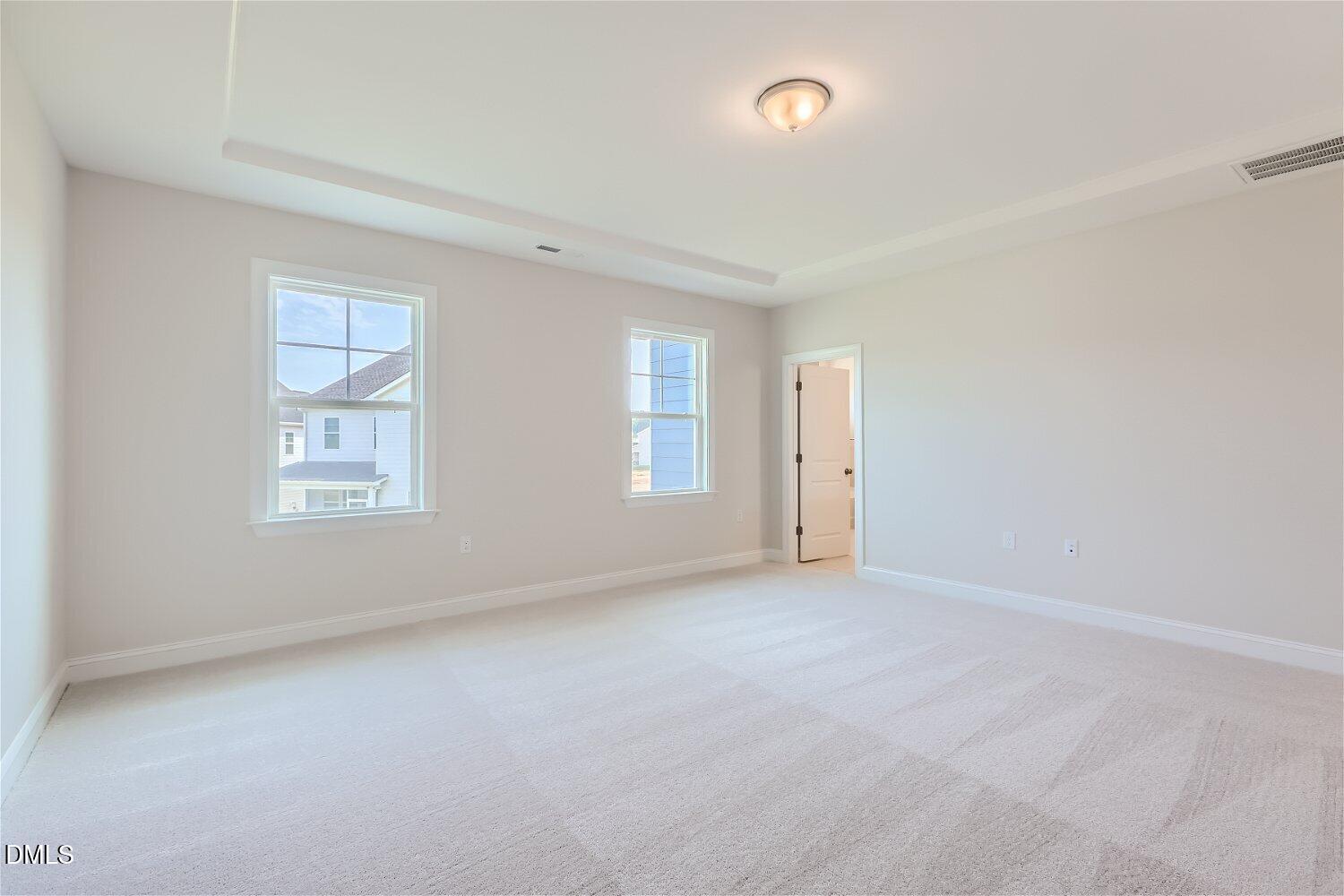 124 Fablewood Trail Garner, NC 27529 - Photo 9 of 27 an empty room with windows and closet