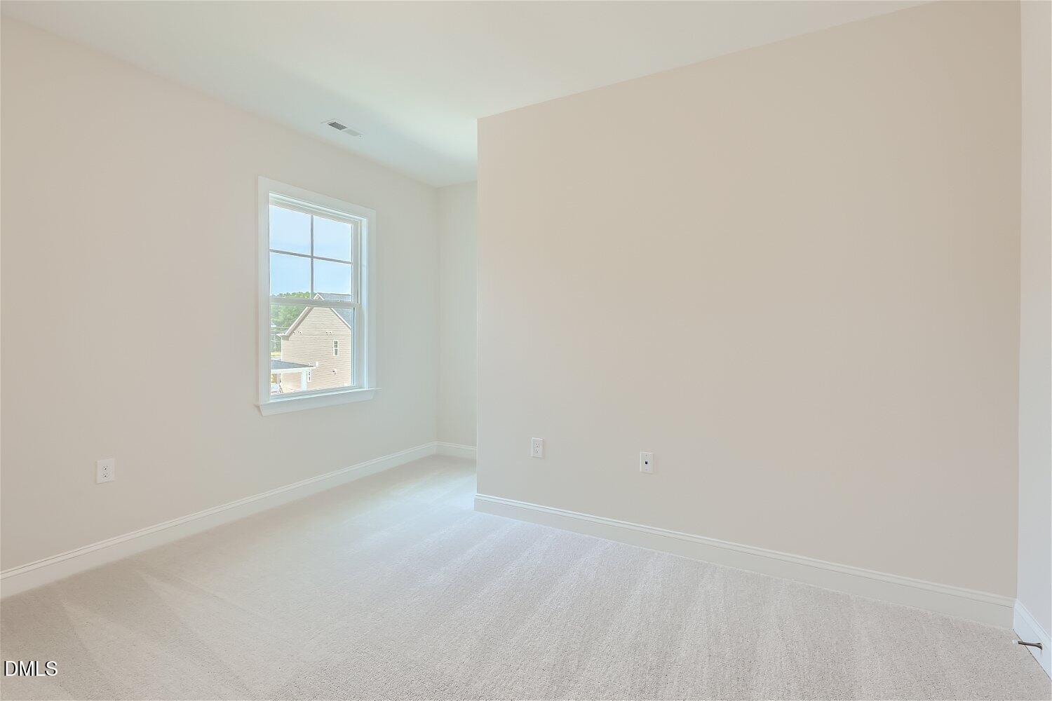 124 Fablewood Trail Garner, NC 27529 - Photo 10 of 27 a view of an empty room with a window