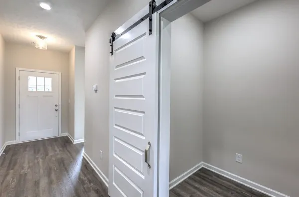 a kitchen with stainless steel appliances granite countertop a sink dishwasher a stove and a microwave oven with granite countertops