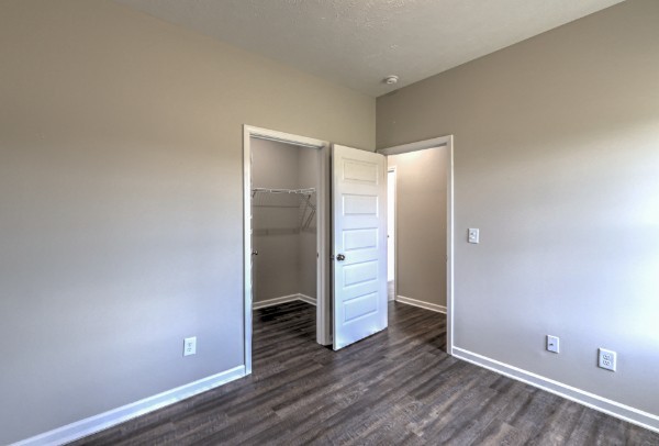 21 Bartow Street Decherd, TN 37324 - Photo 9 of 30 an empty room with wooden floor and entrance