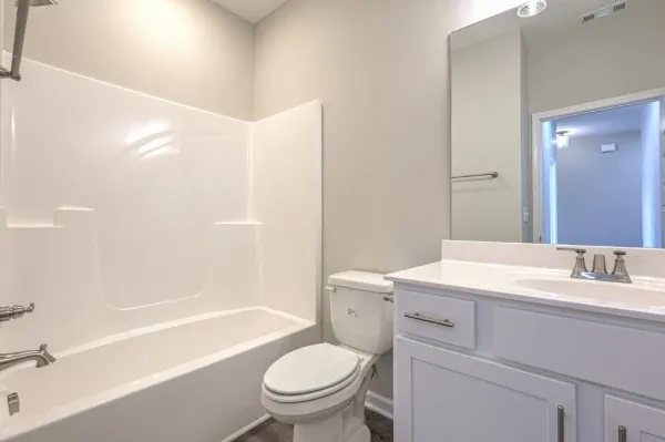 a bathroom with a sink a toilet and a bathtub