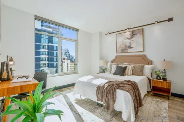 a bedroom with a bed and a window