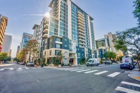 a city street lined with buildings and trees