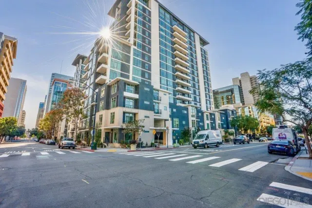 a city street lined with buildings and trees