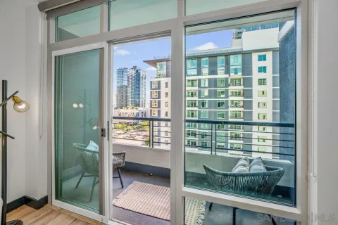 a view of a balcony with wooden floor