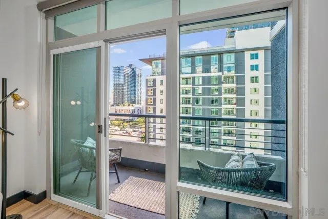 a view of a balcony with wooden floor