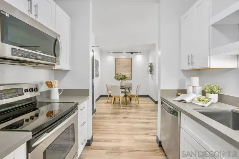 a kitchen with a stove a sink and a microwave