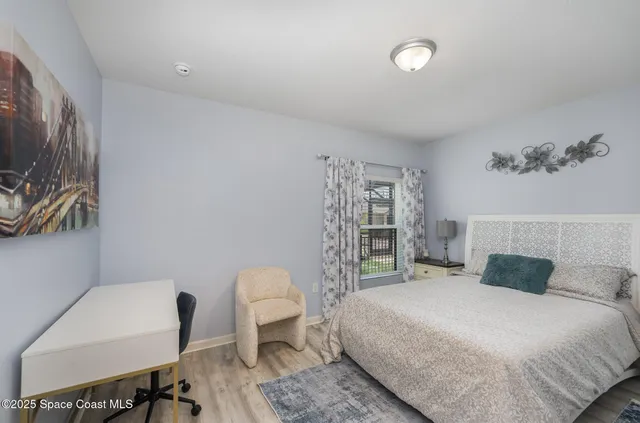 a bedroom with a bed and a table in it