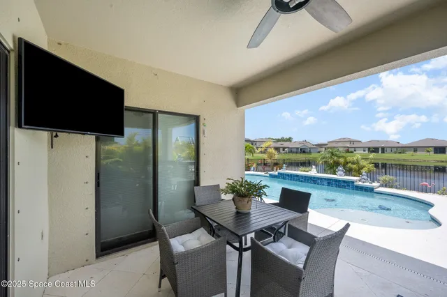 a view of a dining room with furniture window and outside view