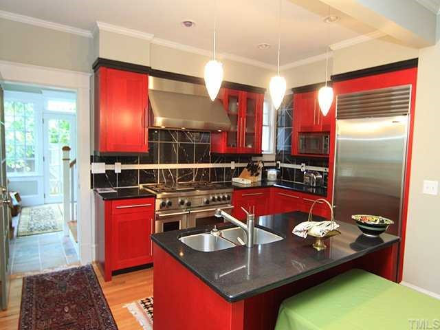 Award Winning Kitchen w/ New Countertops, Backsplash, Lights, Fixtures, Stainless Steel Appliances and Hardwood Floors. Kitchen