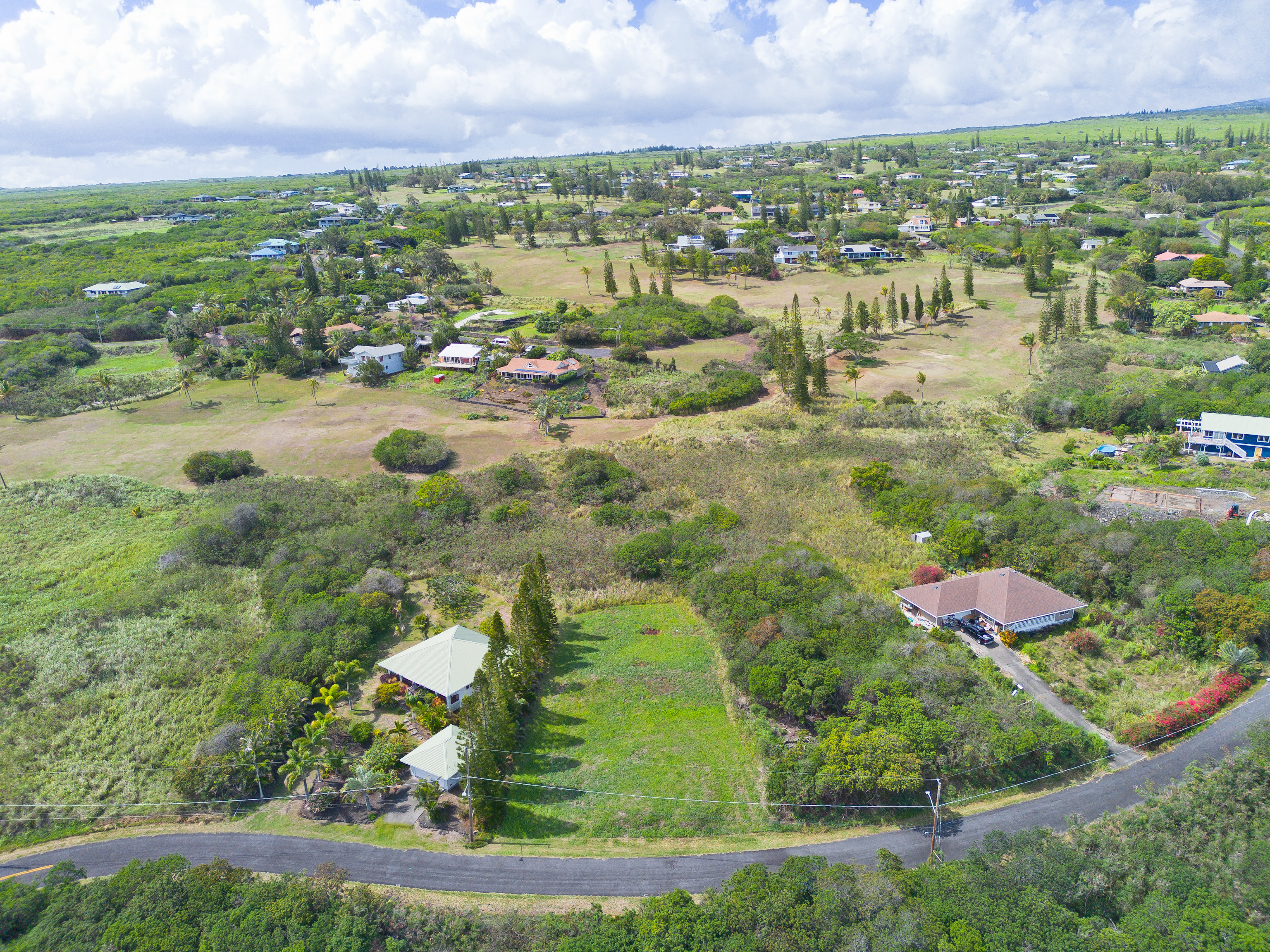 94-1436 Lot 32 Kaulua Circle Naalehu, HI 96772 - Photo 11 of 13 an aerial view of residential houses and outdoor space