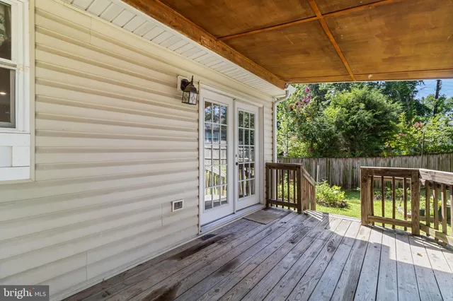 a view of a balcony with wooden floor