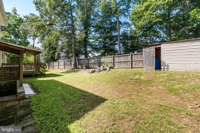 a swimming pool with some trees in the background