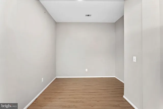 a kitchen with stainless steel appliances granite countertop a refrigerator and a stove