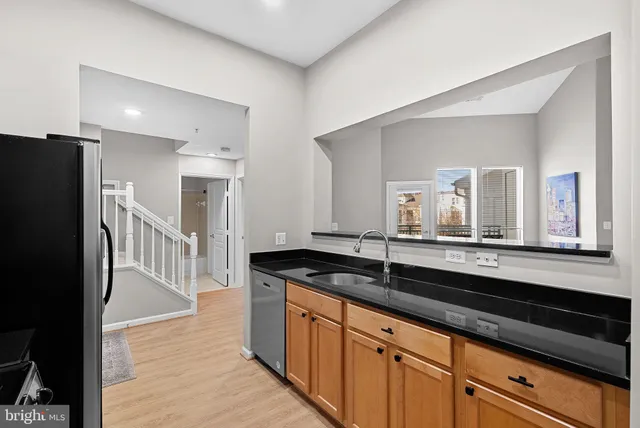 an empty room with a ceiling fan and window