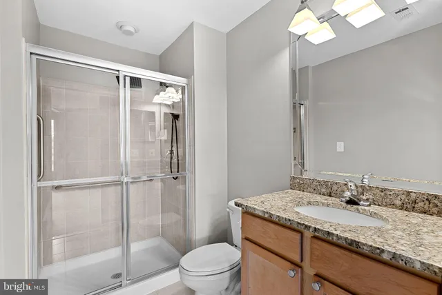 a view of an empty room with painting on the wall