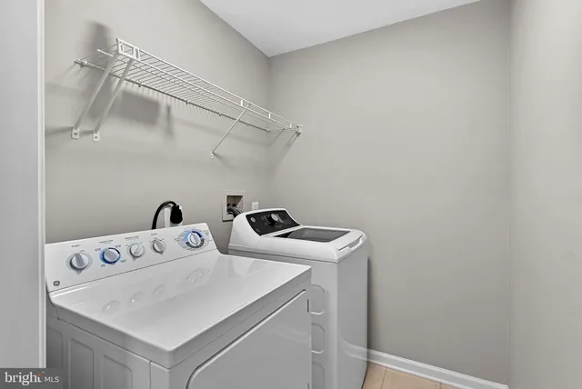 an empty room with a ceiling fan and a window