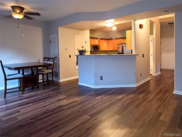 a view of kitchen with furniture and wooden floor