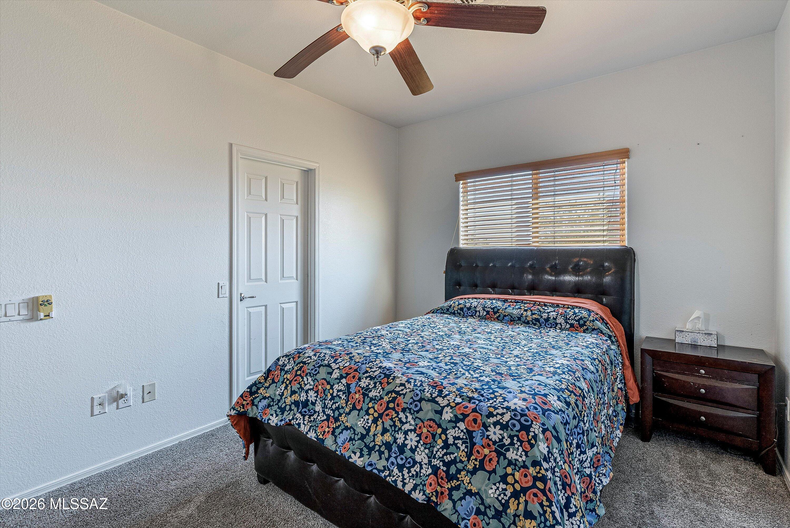 21163 East Treasure Road Red Rock, AZ 85145 - Photo 14 of 35 a bedroom with a bed and a window