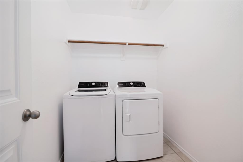 3415 Emerson Road Forney, TX 75126 - Photo 23 of 26 a utility room with dryer and washer