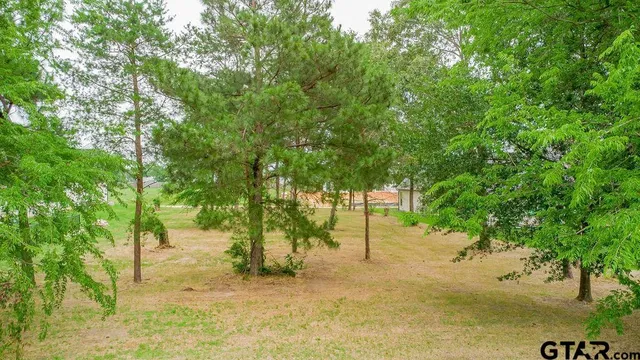 a view of swimming pool with a patio