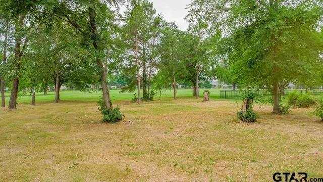 a view of swimming pool with trees